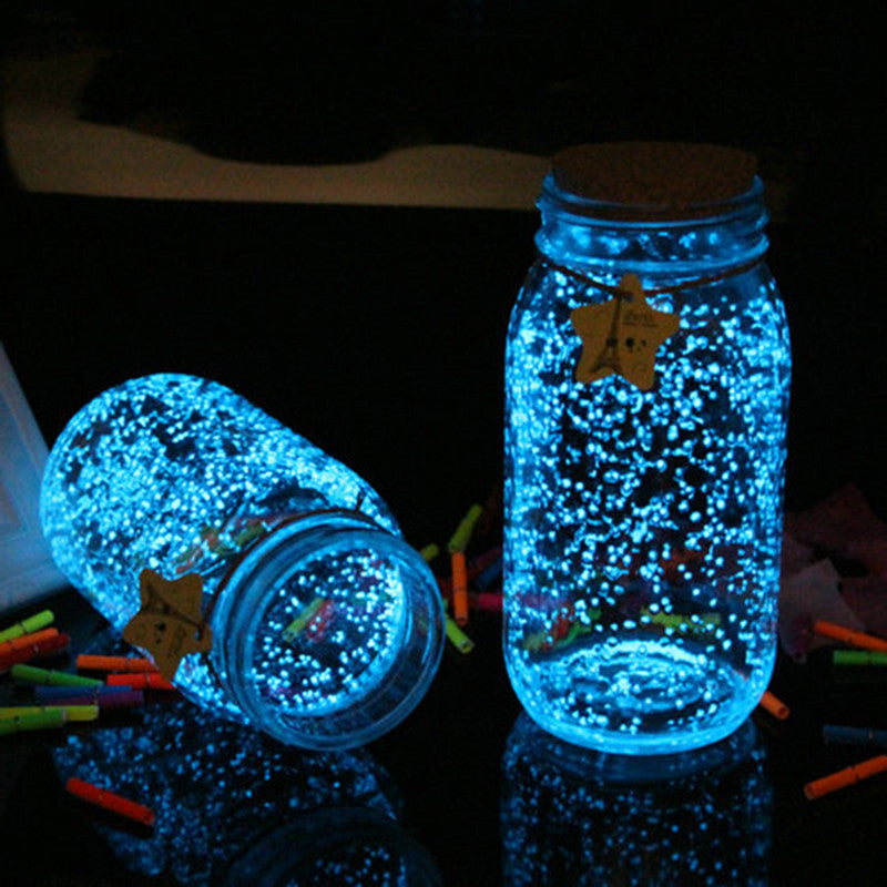 Fluorescent Super luminous Particles glowing in the dark sand